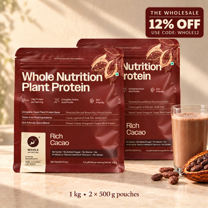 Two pouches of NutriNutrition Whole Nutrition Plant Protein in Rich Cacao flavor, displayed on a warm beige surface with a glass of chocolate drink, cocoa beans, and a promotional wholesale discount badge in the top right corner.