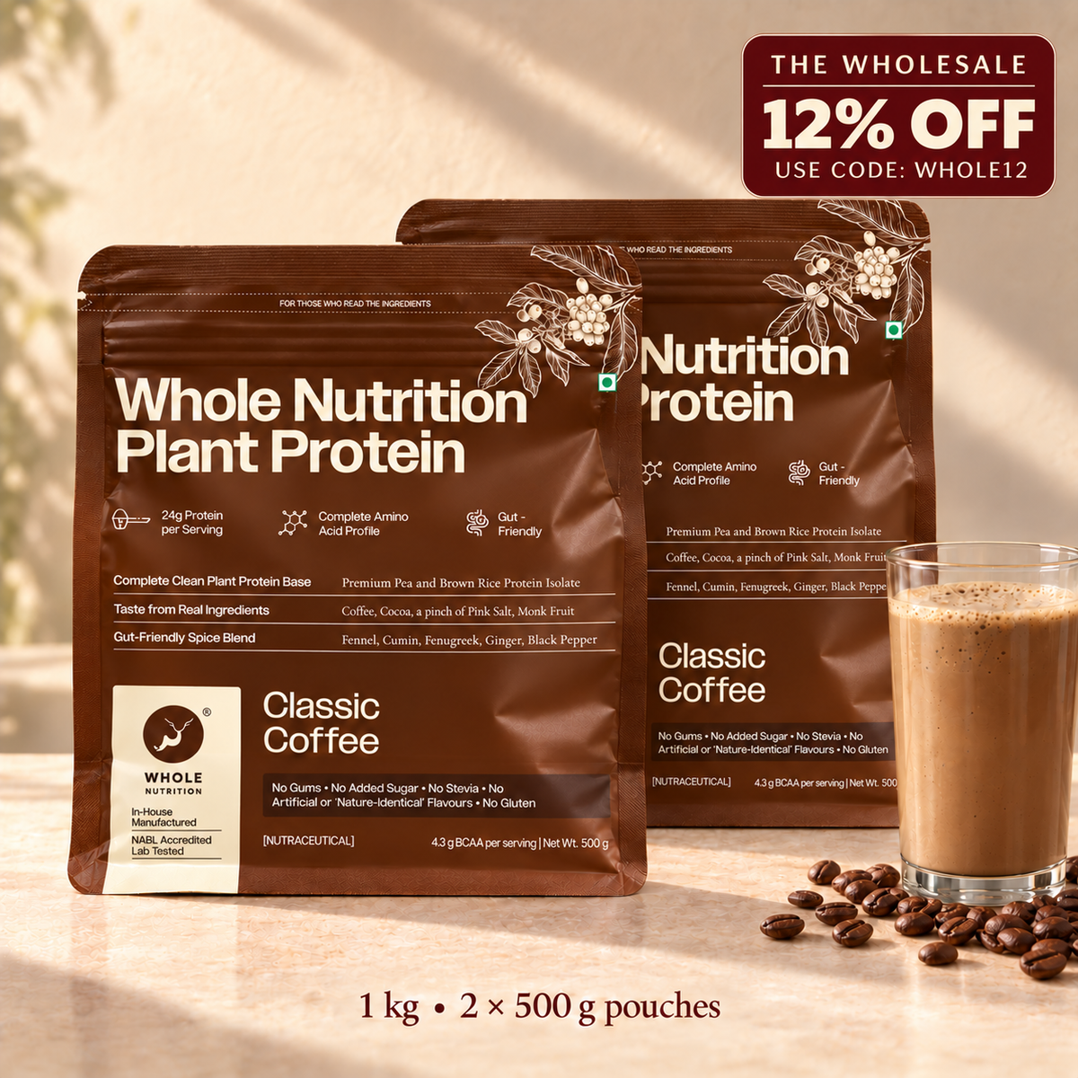 Two brown Whole Nutrition Plant Protein Classic Coffee pouches are shown on a warm beige surface with coffee beans and a glass of frothy coffee. A red promotional badge in the top right says 'The Wholesale 12% Off Use Code: WHOLE12'.