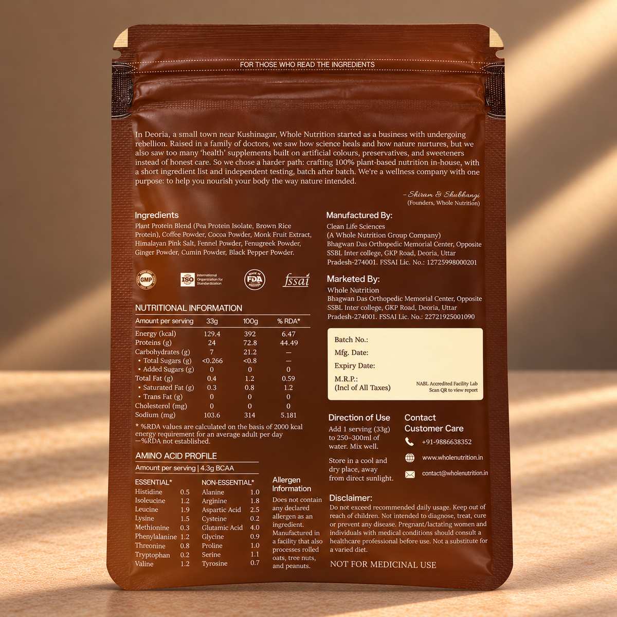 The back of a brown bag of Whole Nature's Protein Isolate powder, showing detailed nutritional information, ingredients, manufacturer details, and usage directions on a neutral beige background.