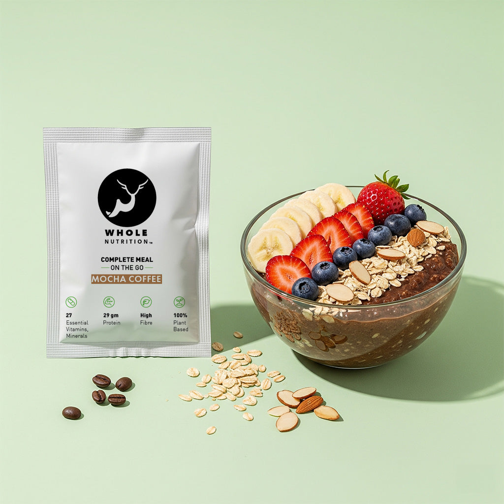 high proten oats meal whole nutrition mocha coffee package with a bowl of chia pudding topped with fruits and seeds on a light green background