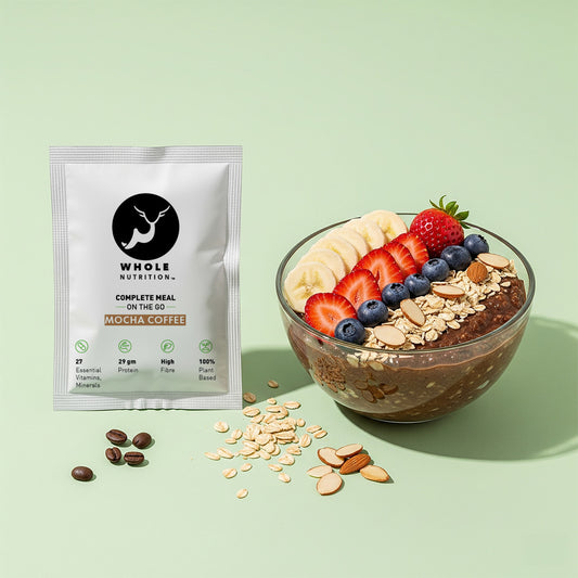high proten oats meal whole nutrition mocha coffee package with a bowl of chia pudding topped with fruits and seeds on a light green background