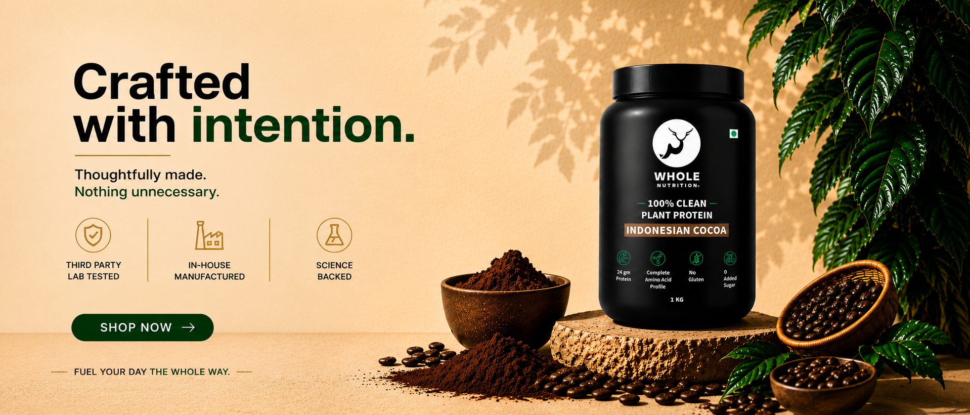 Black Whole nutrition plant protein powder container with text 'Crafted with intention' on a warm background with plants.